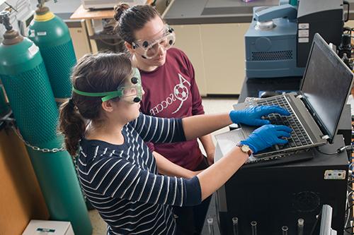 two students doing science